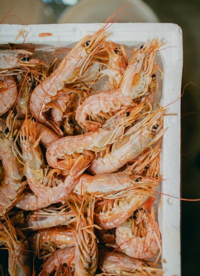 White in a container brown dried fish
